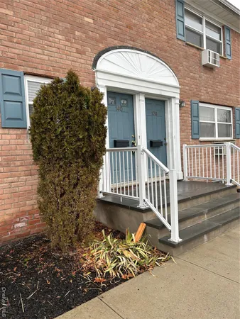 a front view of a house with a porch