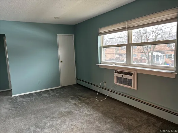 an empty room with a fireplace