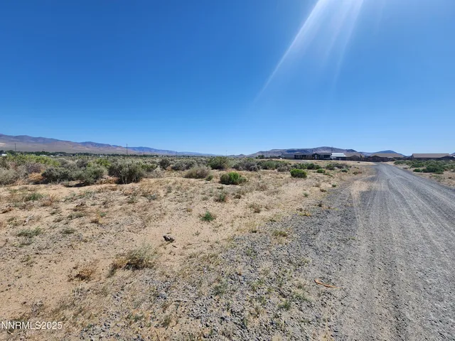 a view of an ocean beach and mountain