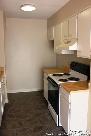 a view of kitchen sink and stove