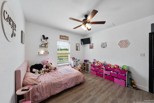 a bedroom with bed and a window
