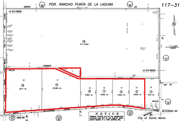 a view of a house with a yard and potted plants