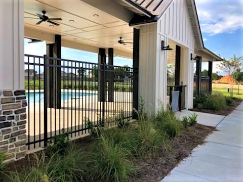 441 Scarborough Street Crestview, FL 32539 - Photo 13 of 17 a view of a house with a small yard and floor to ceiling window