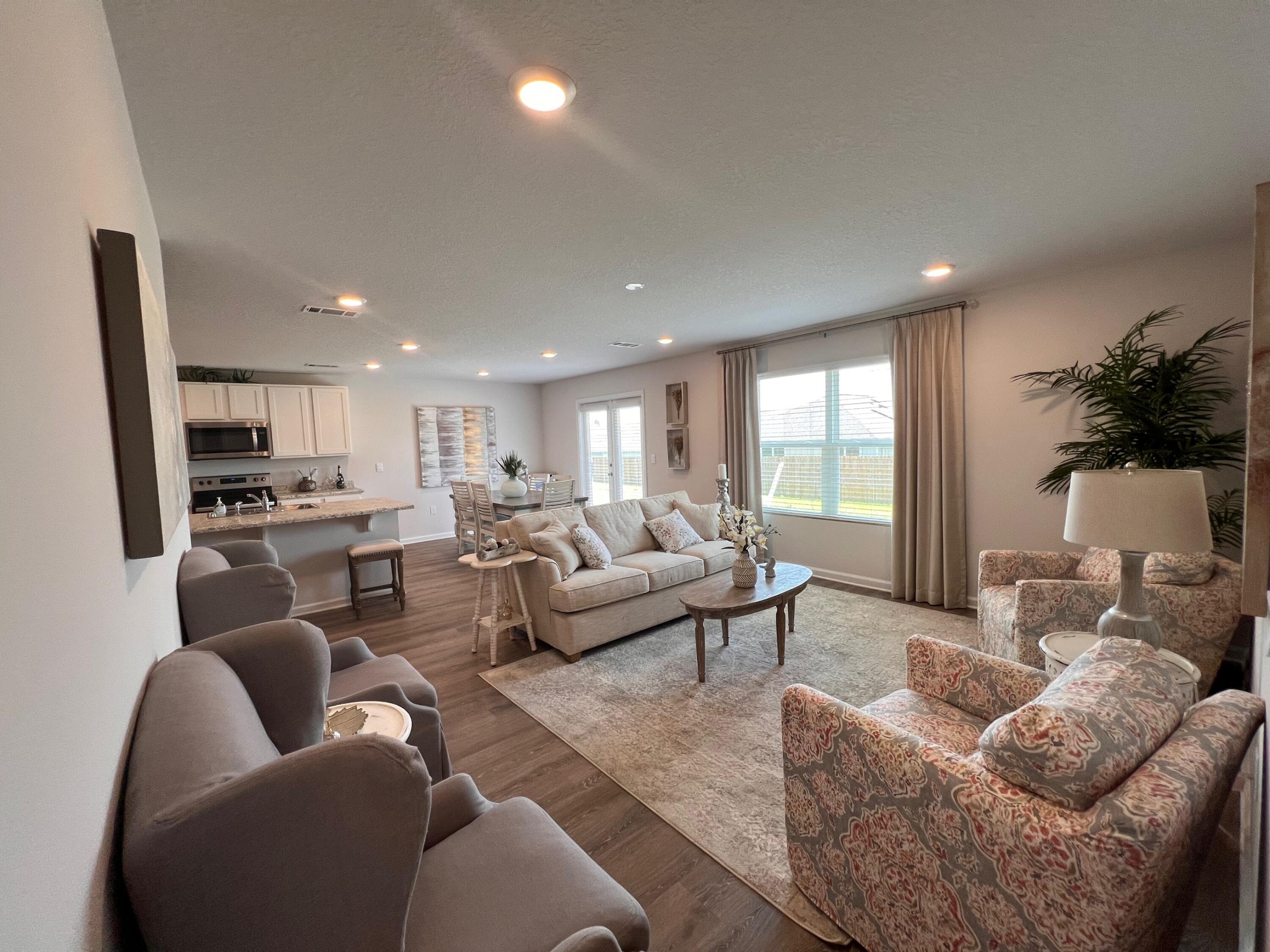 441 Scarborough Street Crestview, FL 32539 - Photo 6 of 17 a living room with furniture kitchen view and a large window