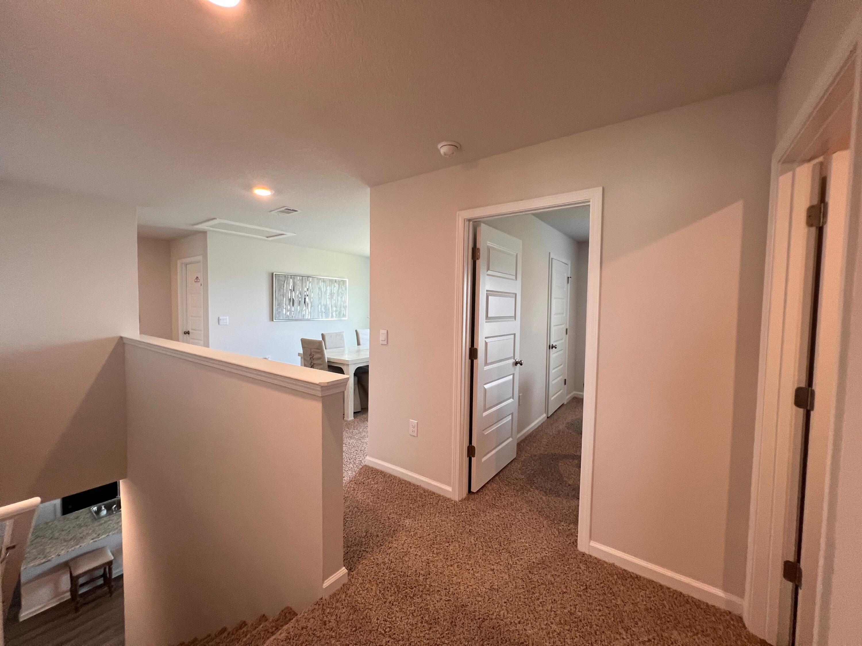 441 Scarborough Street Crestview, FL 32539 - Photo 9 of 17 a view of hallway with furniture and a refrigerator
