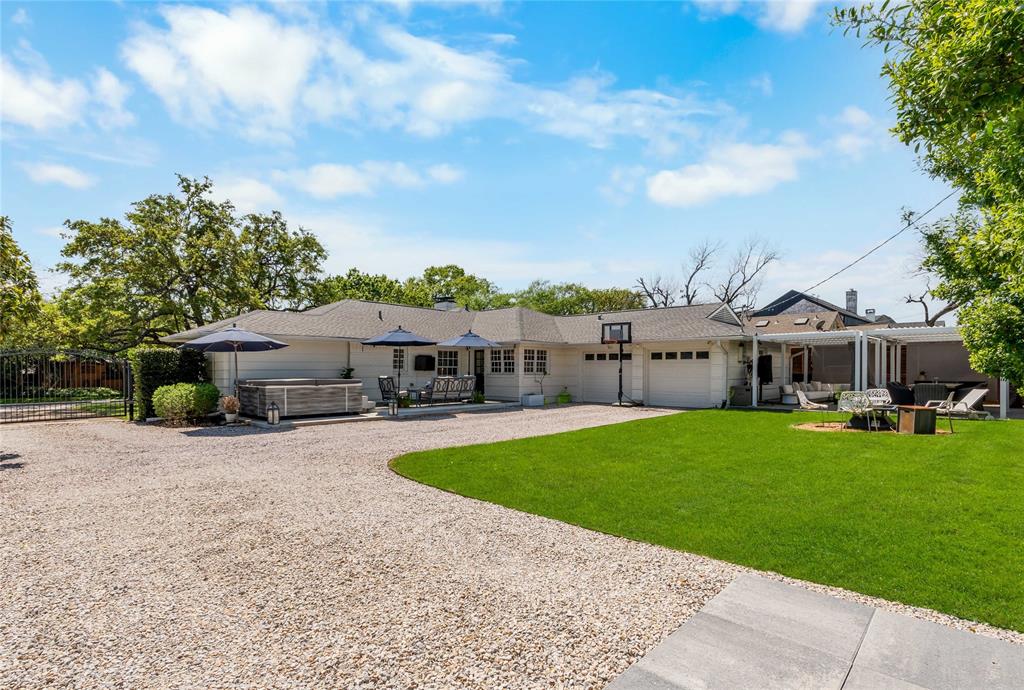 6841 Joyce Way Dallas, TX 75225 - Photo 13 of 13 Large backyard with 2 patios, electric gate, and extra parking pad.