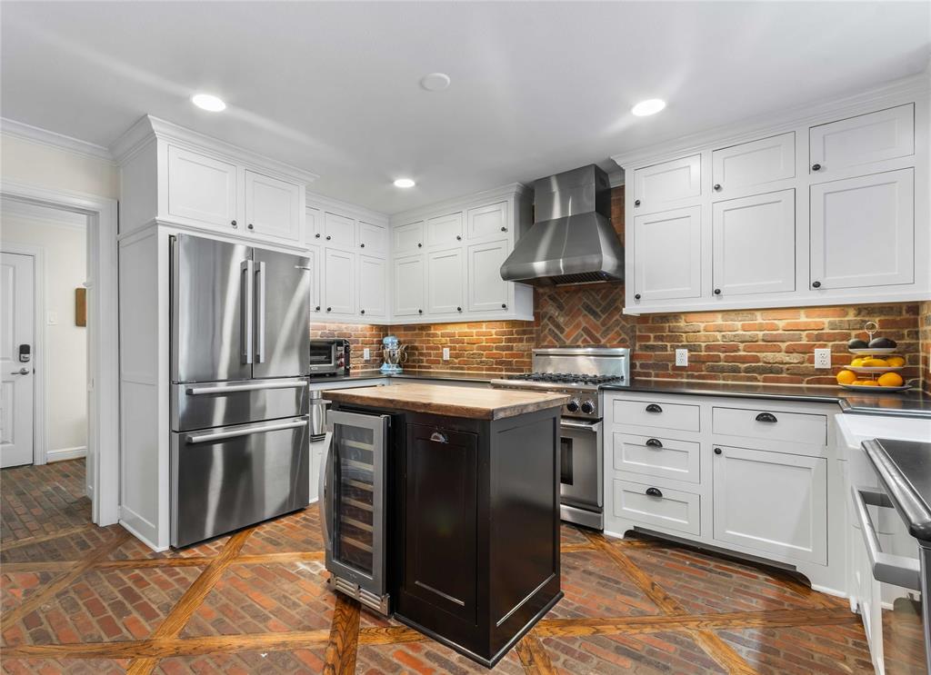 6841 Joyce Way Dallas, TX 75225 - Photo 4 of 13 Kitchen and door to laundry room