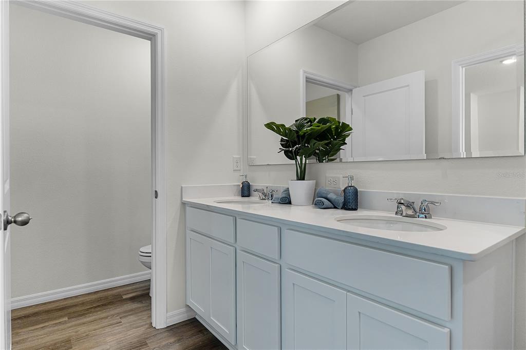 3390 Ft Mellon Lane Sanford, FL 32773 - Photo 13 of 24 a bathroom with a sink a vanity and a mirror