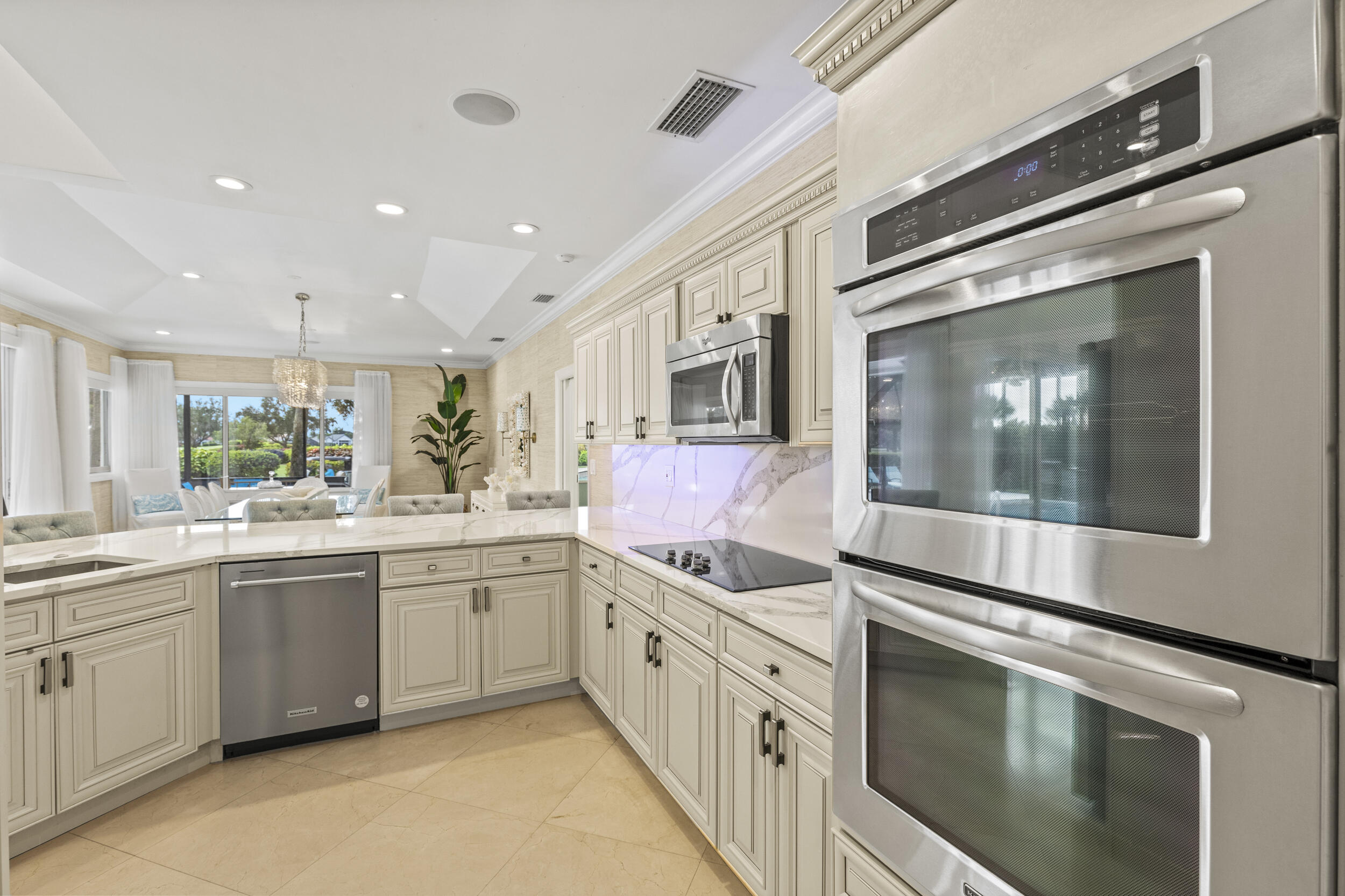 10431 Stonebridge Boulevard Boca Raton, FL 33498 - Photo 13 of 53 a kitchen with stainless steel appliances granite countertop a sink and cabinets