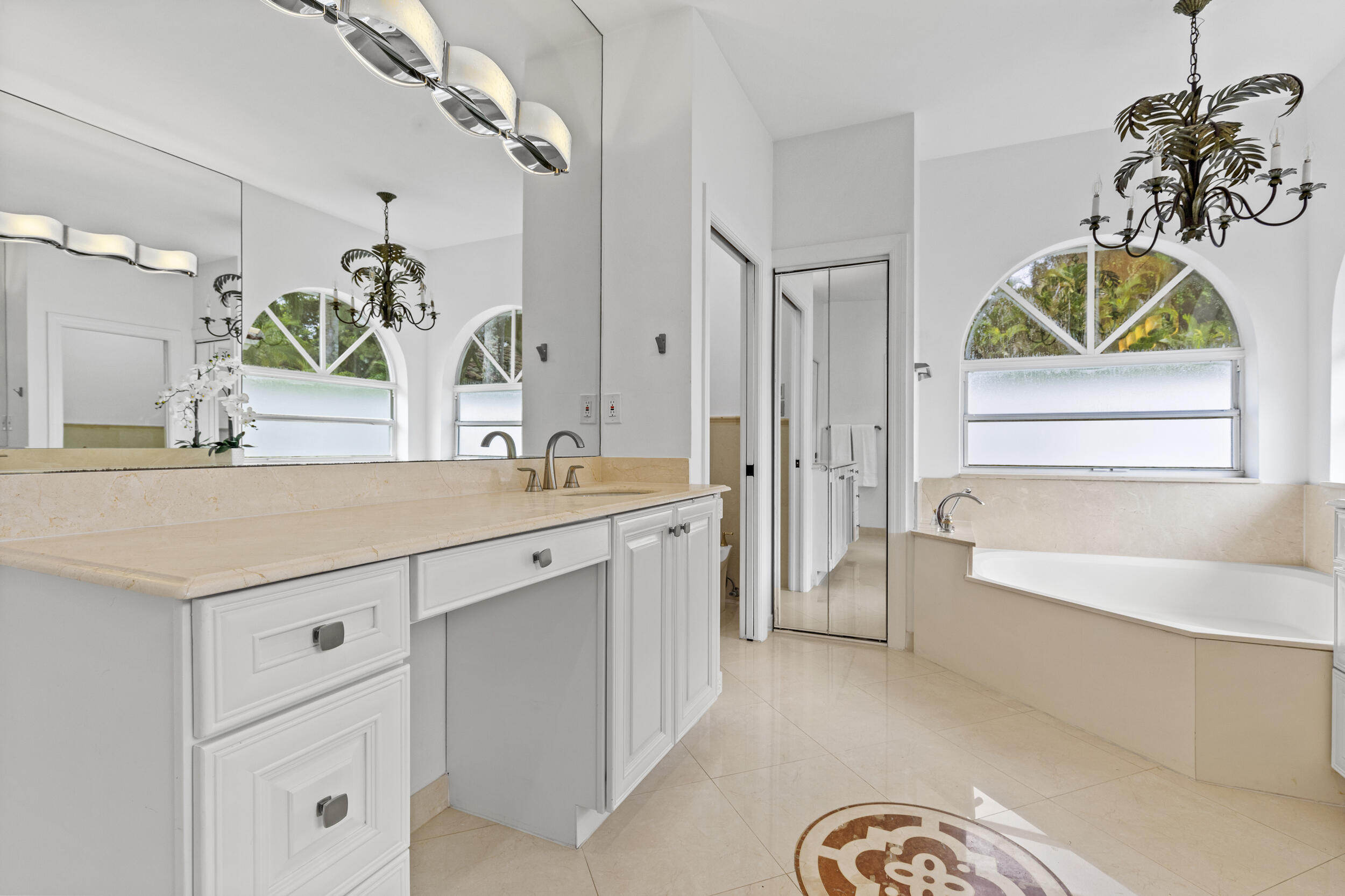 10431 Stonebridge Boulevard Boca Raton, FL 33498 - Photo 21 of 53 a bathroom with a sink a vanity and a bathtub