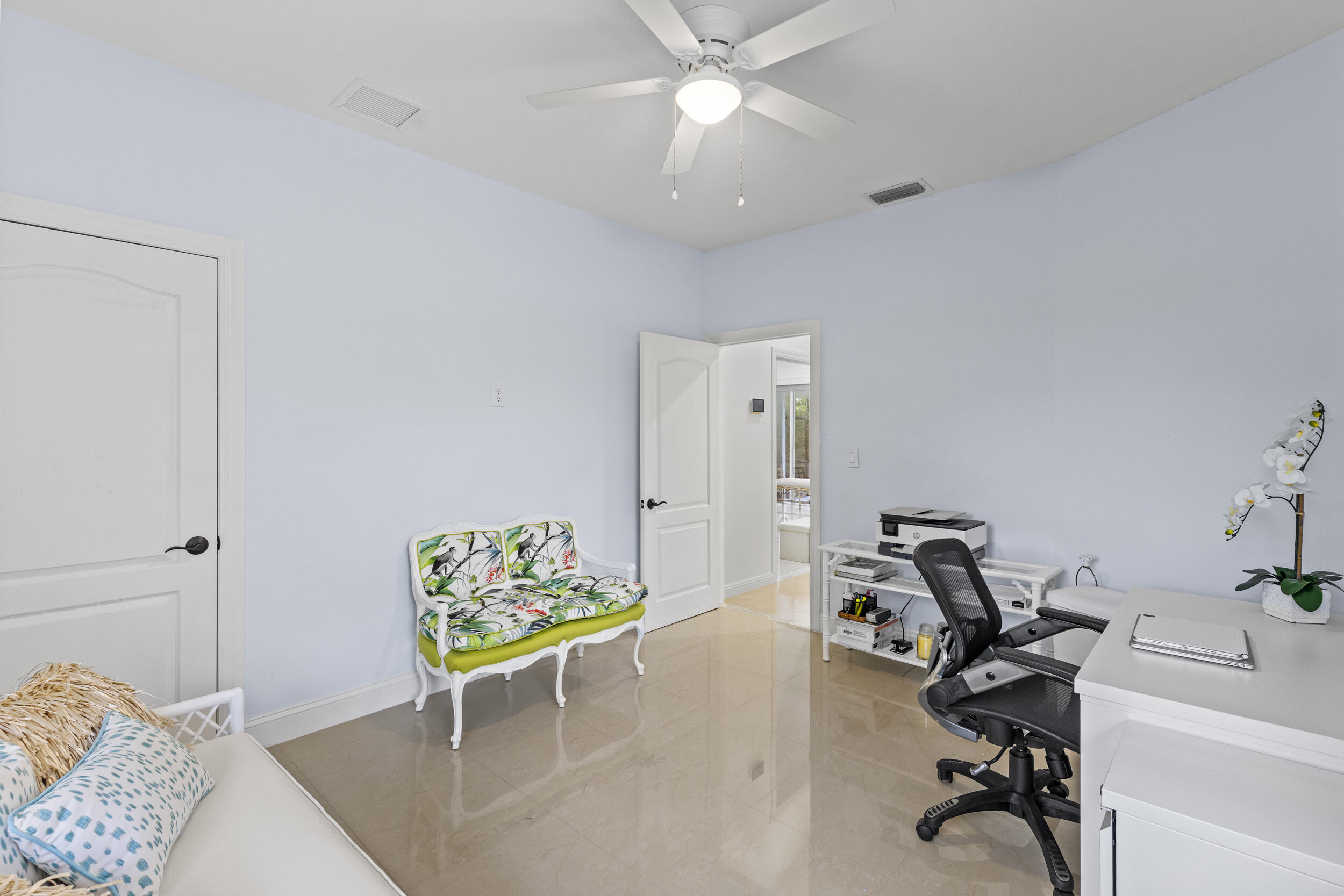 10431 Stonebridge Boulevard Boca Raton, FL 33498 - Photo 25 of 53 a living room with furniture and a chandelier