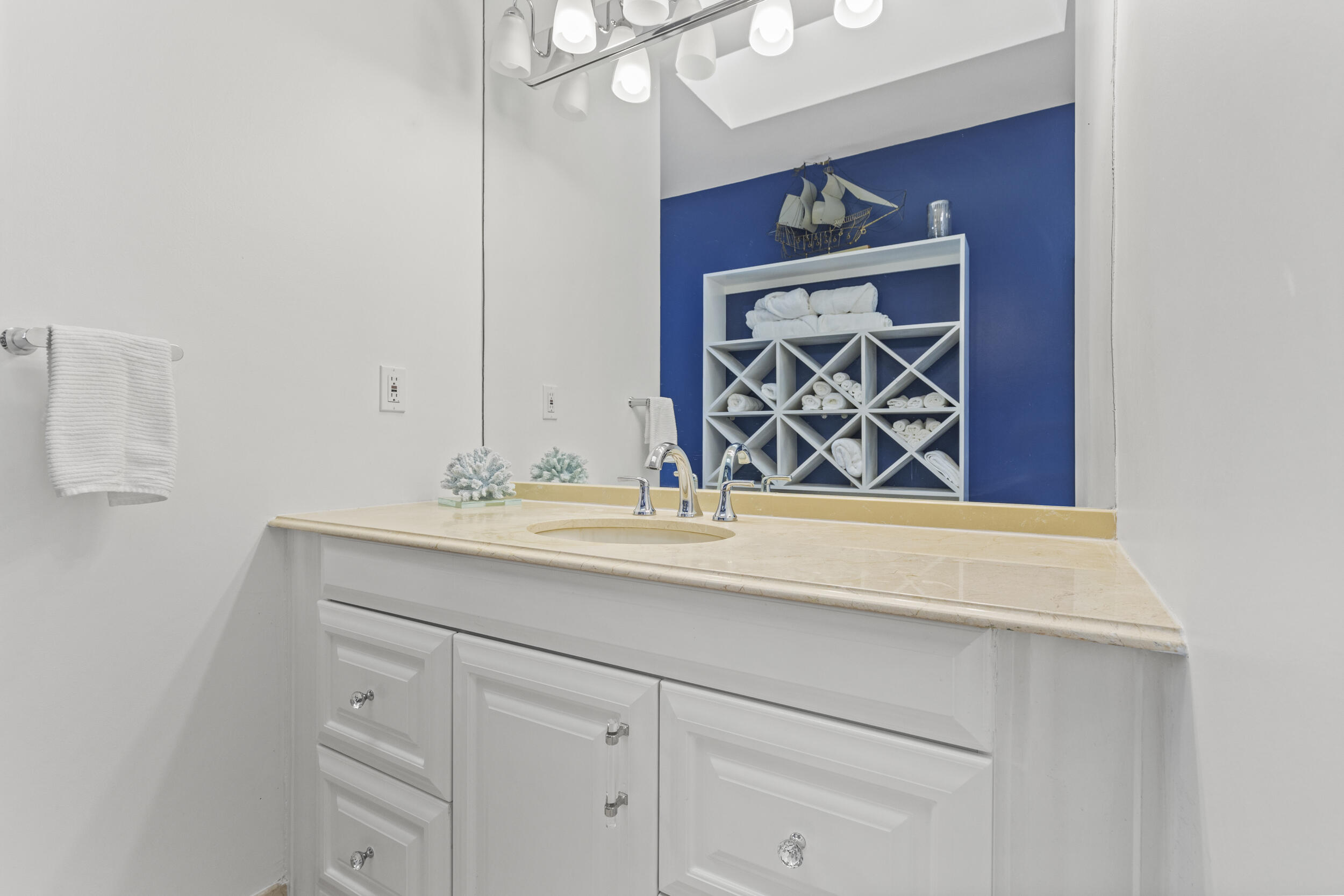10431 Stonebridge Boulevard Boca Raton, FL 33498 - Photo 27 of 53 a bathroom with a sink and a mirror