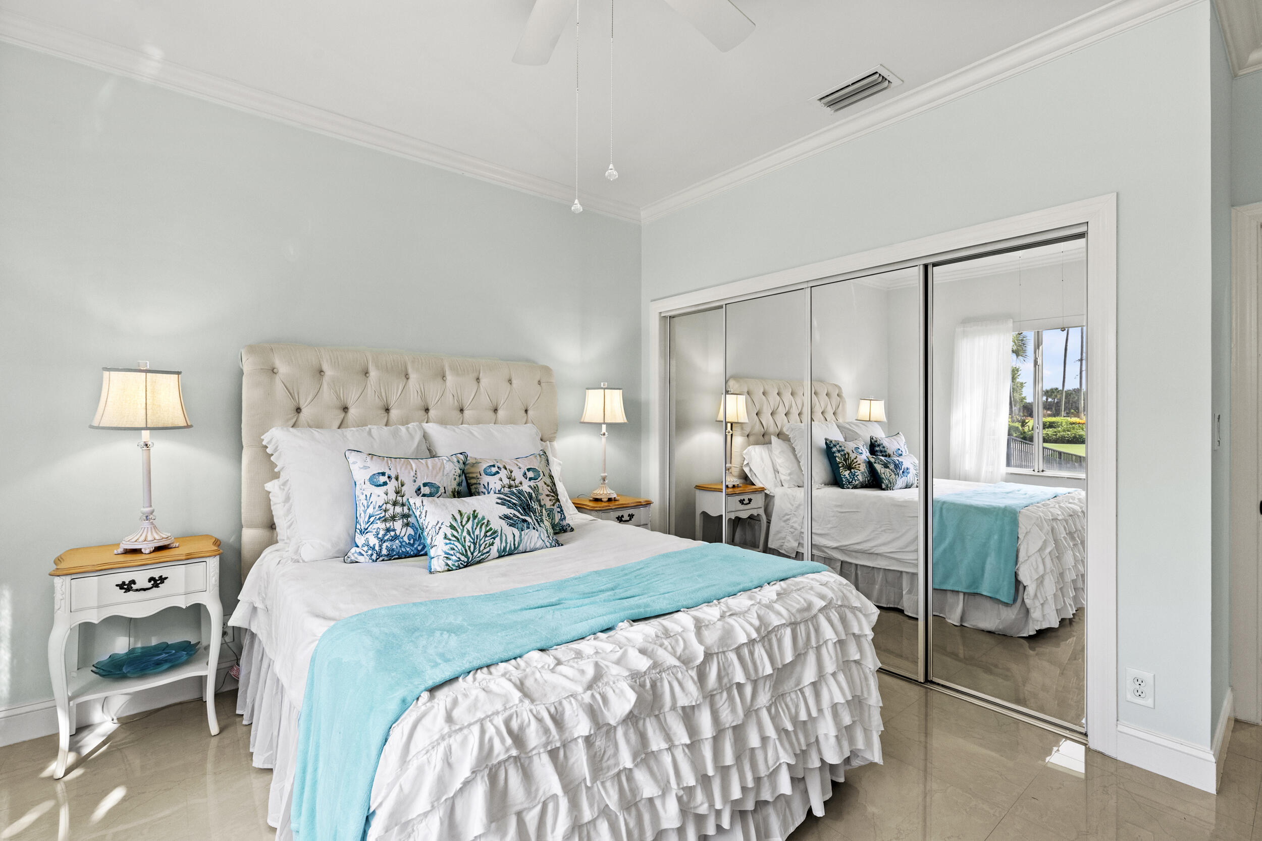 10431 Stonebridge Boulevard Boca Raton, FL 33498 - Photo 29 of 53 a bedroom with a bed and a mirror