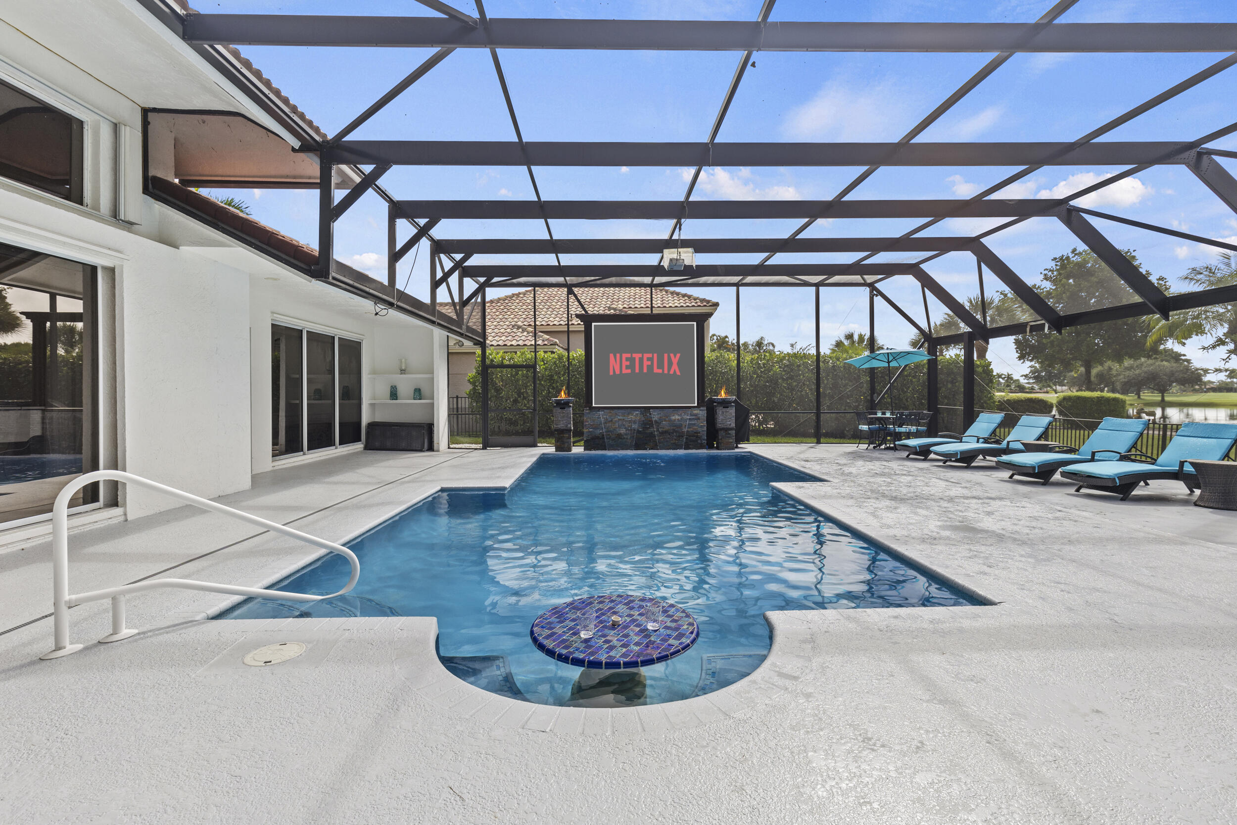 10431 Stonebridge Boulevard Boca Raton, FL 33498 - Photo 34 of 53 a view of a porch with a table and chairs