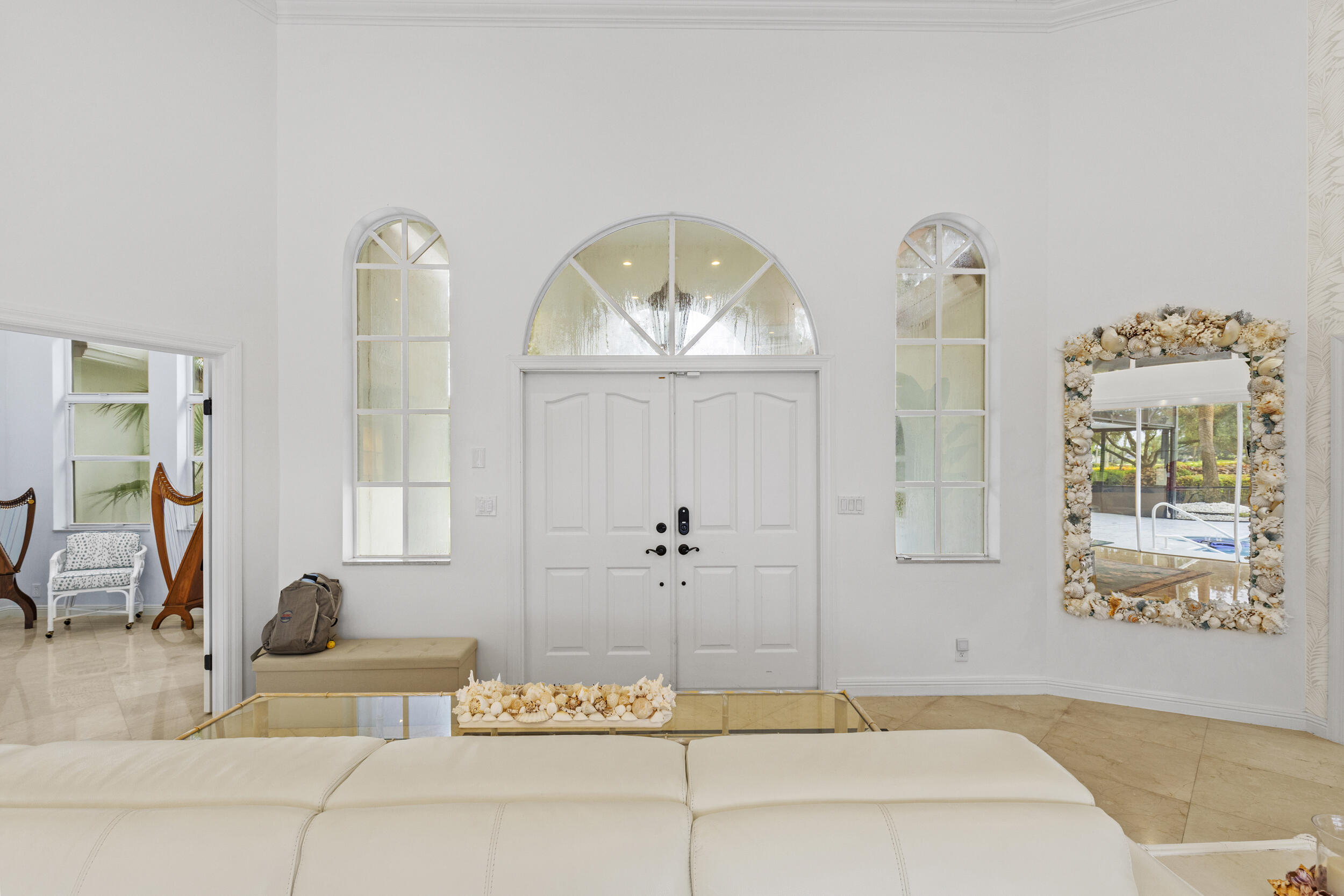 10431 Stonebridge Boulevard Boca Raton, FL 33498 - Photo 4 of 53 a living room with furniture and a large window