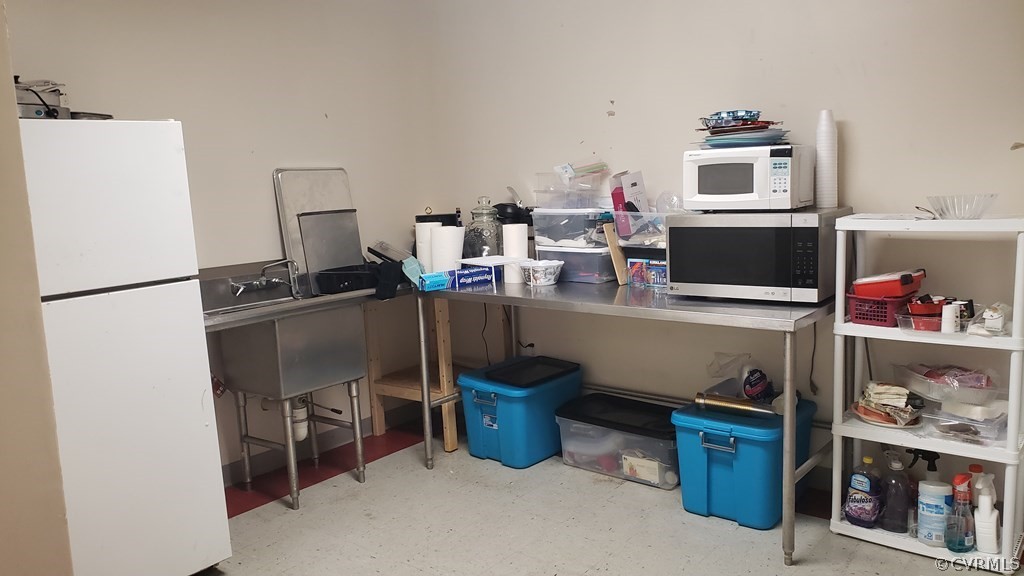 11944 Courthouse Road Victoria, VA 23974 - Photo 6 of 12 a work place with furniture and a refrigerator