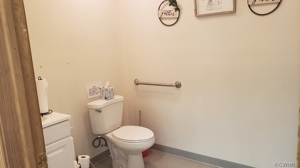 11944 Courthouse Road Victoria, VA 23974 - Photo 7 of 12 a white toilet sitting next to a white sink