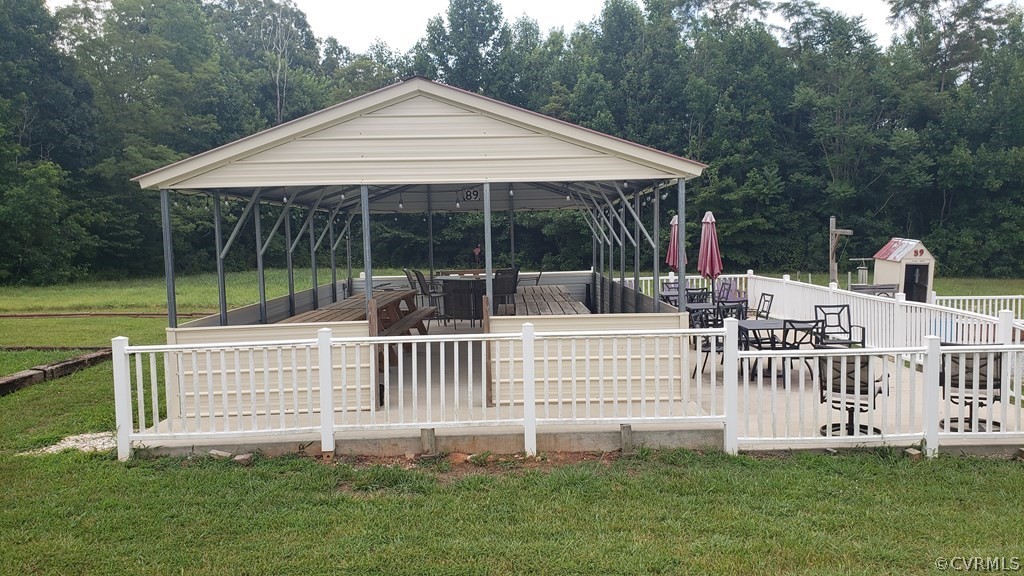 11944 Courthouse Road Victoria, VA 23974 - Photo 9 of 12 a view of house with a yard deck and a garden