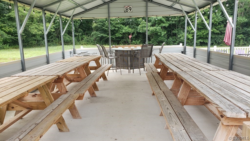 11944 Courthouse Road Victoria, VA 23974 - Photo 10 of 12 a view of a patio with a table chairs and backyard