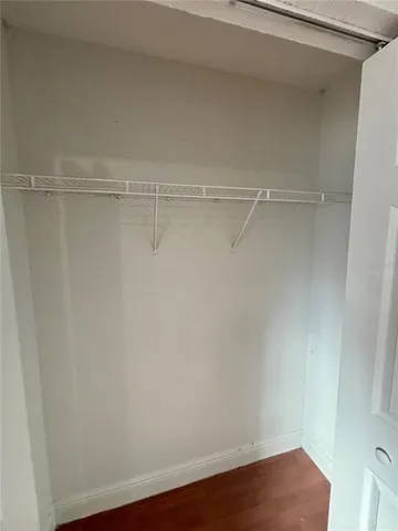 a view of an empty walk in closet