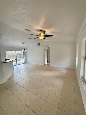 a view of a livingroom and a staircase