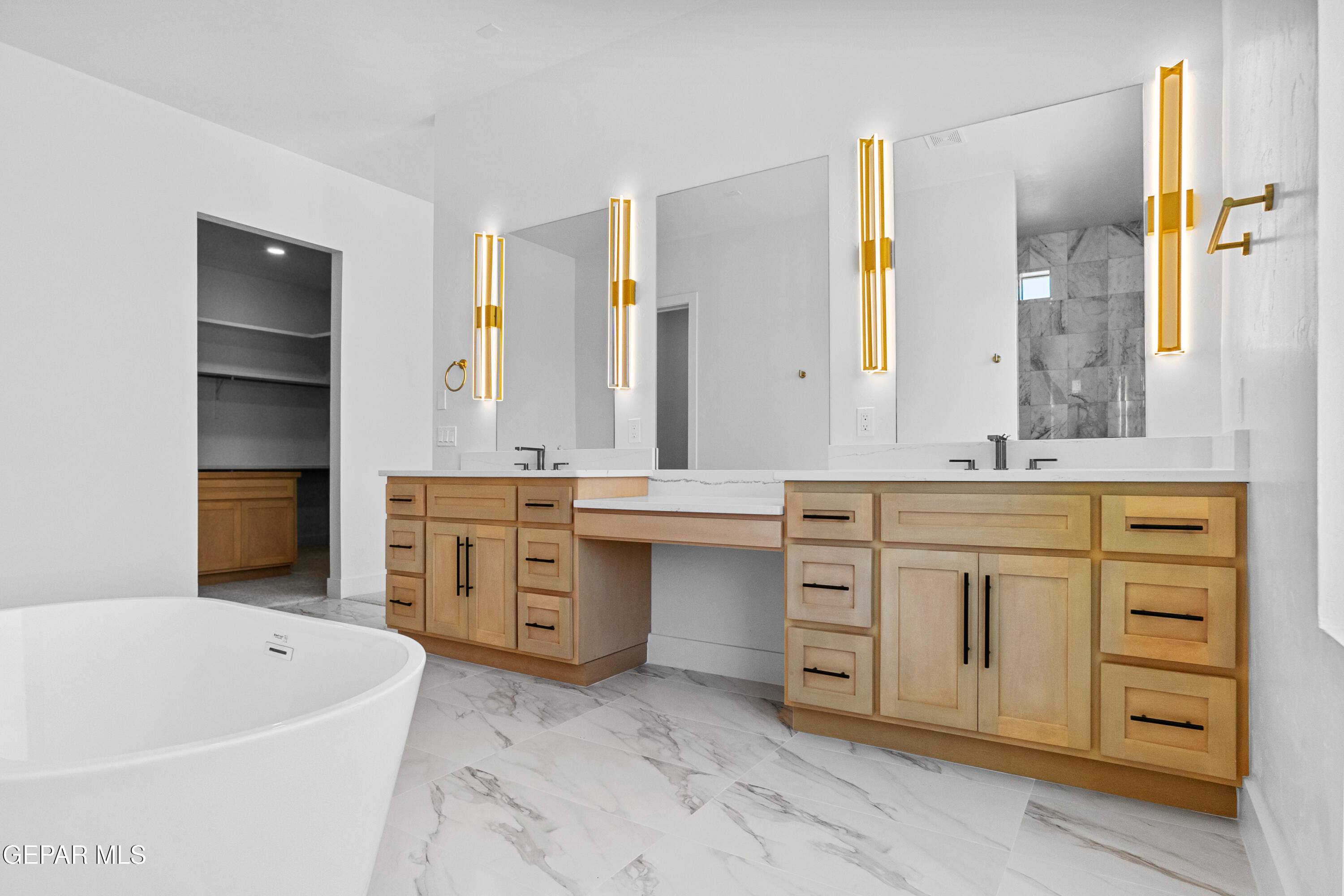 5699 Rio Bonito Circle El Paso, TX 79932 - Photo 17 of 25 a bathroom with a tub sink and mirror