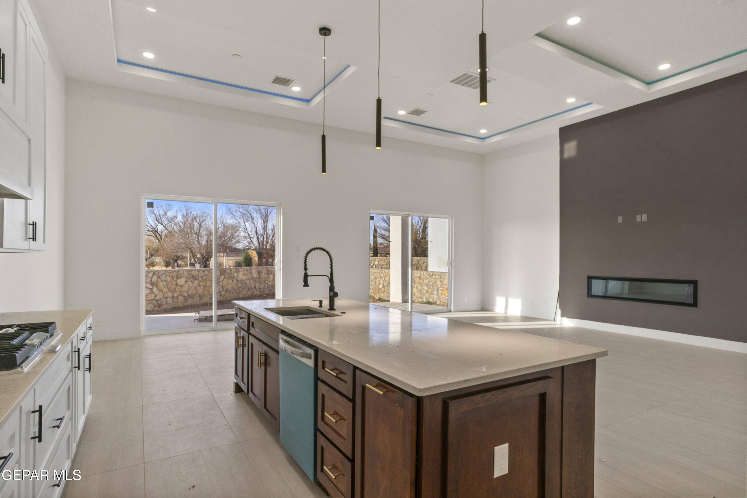 5699 Rio Bonito Circle El Paso, TX 79932 - Photo 24 of 25 a kitchen with stainless steel appliances granite countertop a sink a stove and a refrigerator