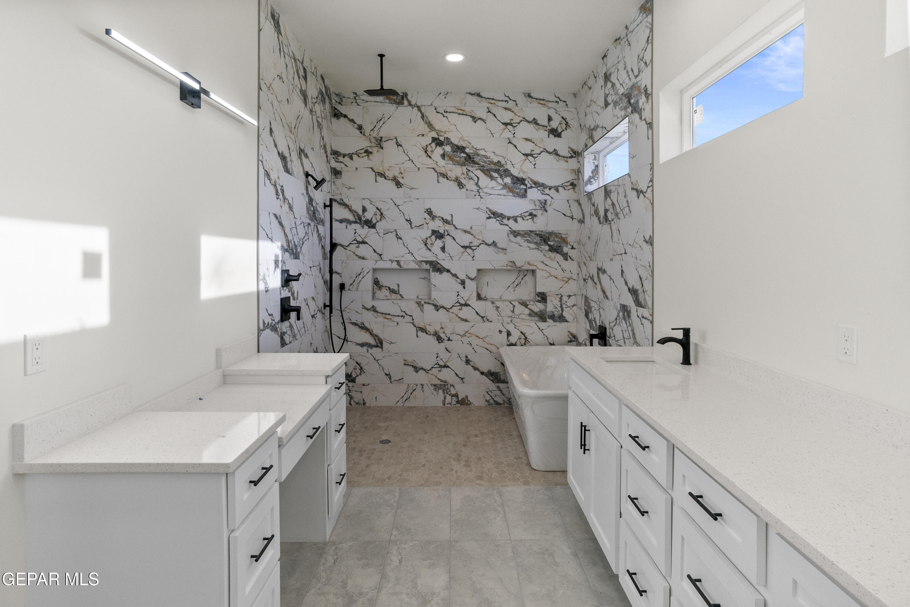 5699 Rio Bonito Circle El Paso, TX 79932 - Photo 25 of 25 a bathroom with a double vanity sink mirror and shower