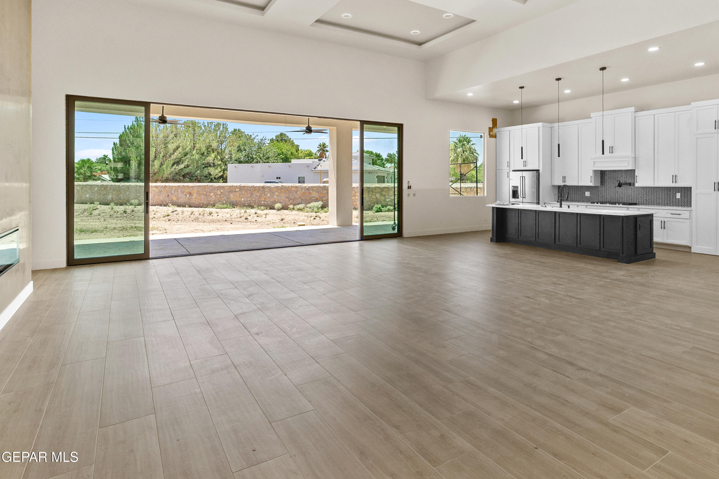 5699 Rio Bonito Circle El Paso, TX 79932 - Photo 3 of 25 a view of a kitchen with a sink and a large window