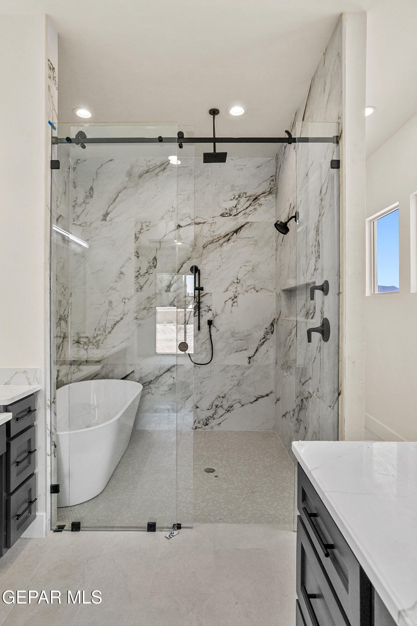 5699 Rio Bonito Circle El Paso, TX 79932 - Photo 4 of 25 a bathroom with a bathtub and shower