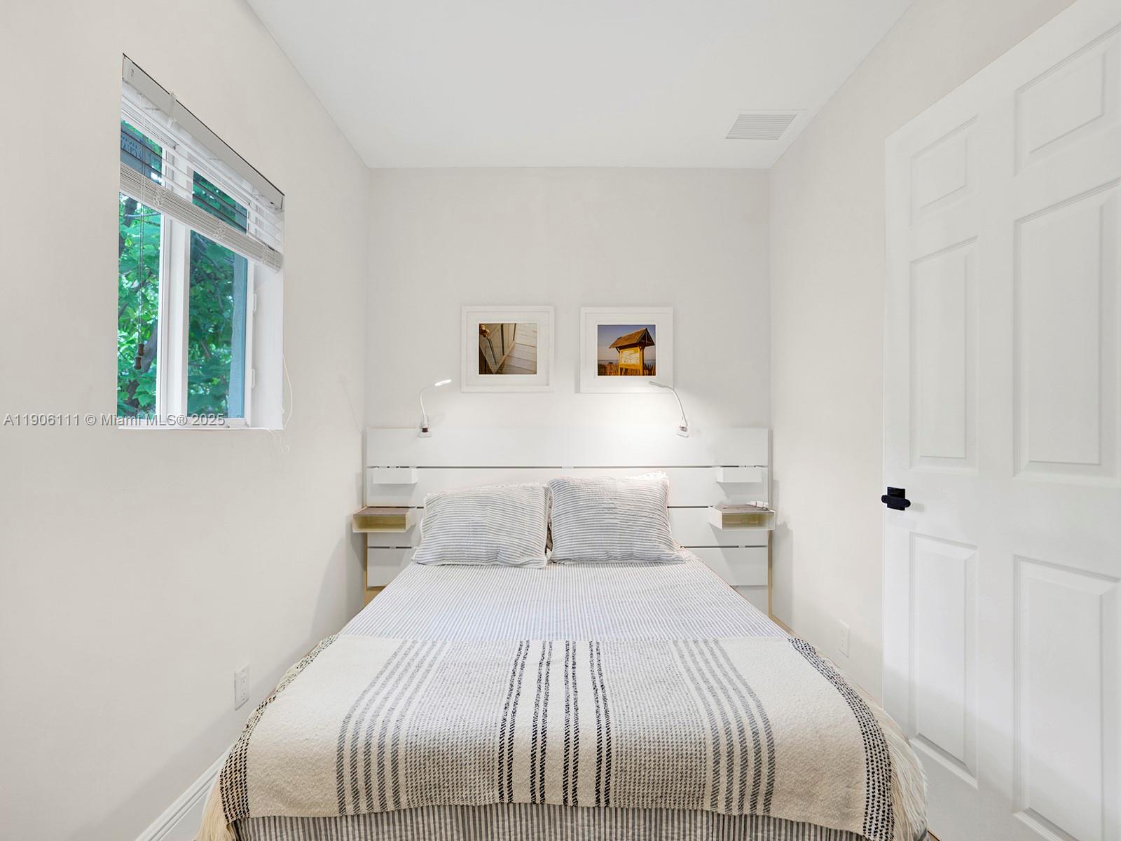 3547 William Avenue Miami, FL 33133 - Photo 14 of 20 a bedroom with a large bed and a window