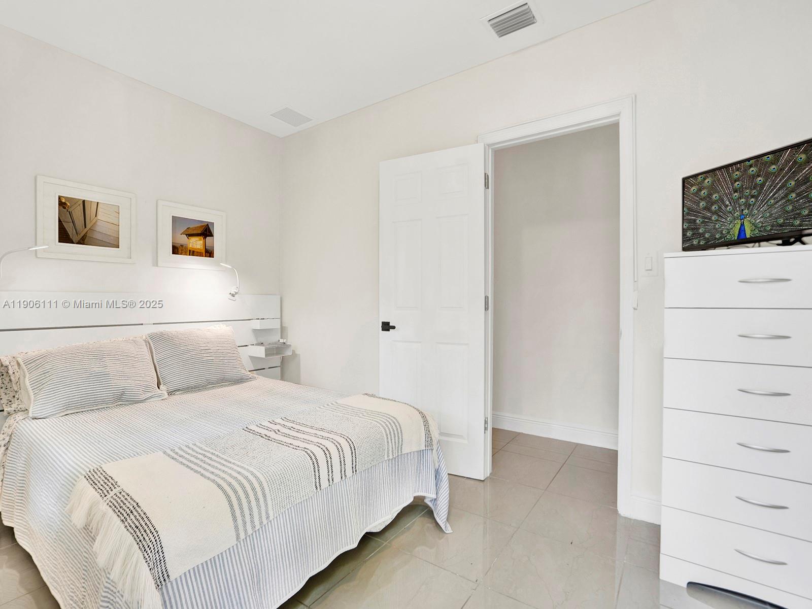 3547 William Avenue Miami, FL 33133 - Photo 15 of 20 a bedroom with a bed and a closet