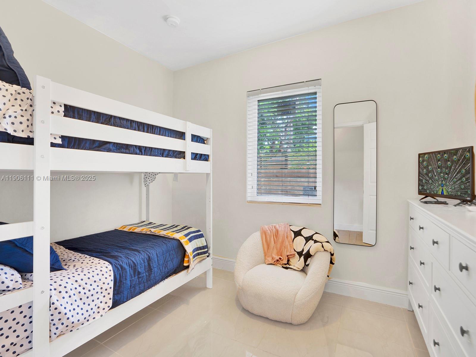 3547 William Avenue Miami, FL 33133 - Photo 16 of 20 a bedroom with a bed and a couch