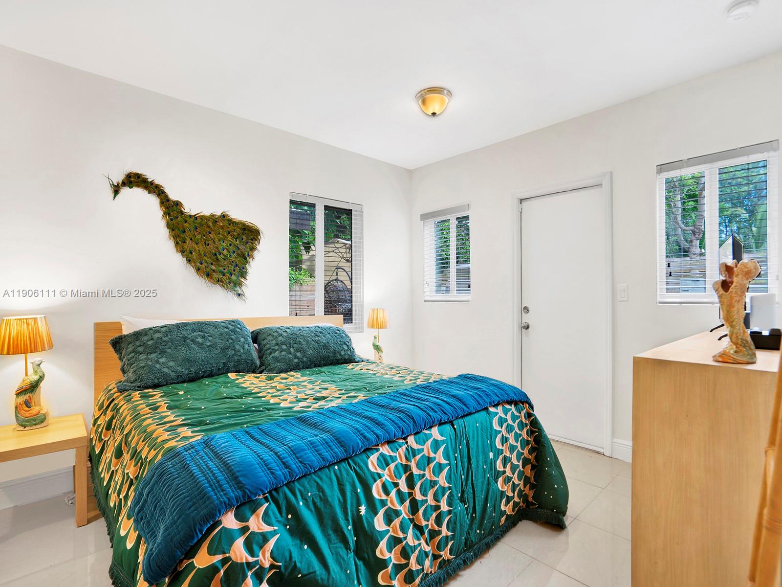 3547 William Avenue Miami, FL 33133 - Photo 18 of 20 a bedroom with a bed and a potted plant