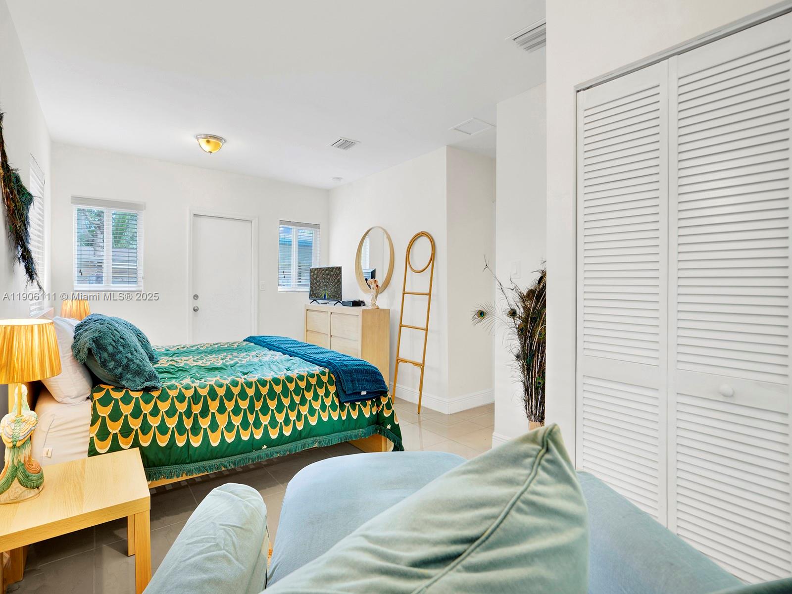 3547 William Avenue Miami, FL 33133 - Photo 20 of 20 a bedroom with a bed couch and a window