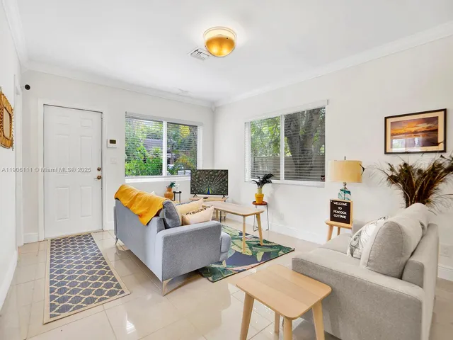 a living room with furniture and a couch