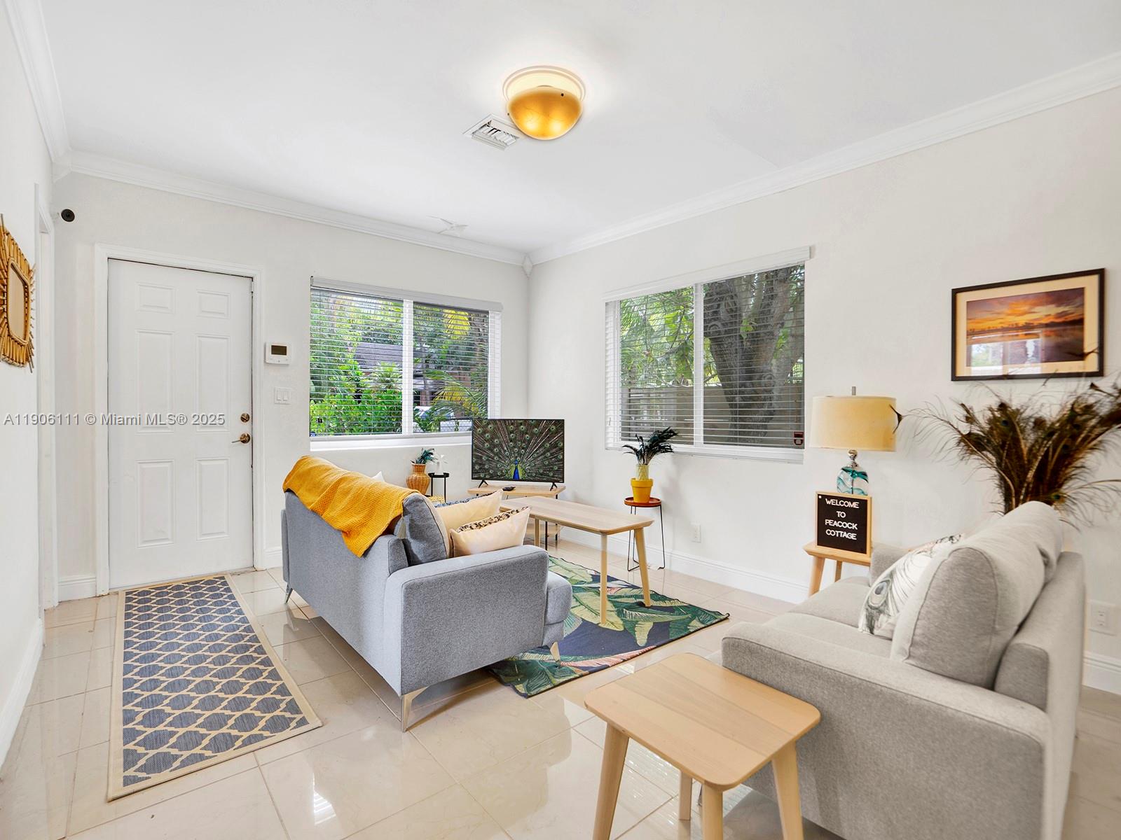 3547 William Avenue Miami, FL 33133 - Photo 10 of 20 a living room with furniture and a couch