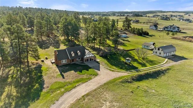 a view of a swimming pool with a yard