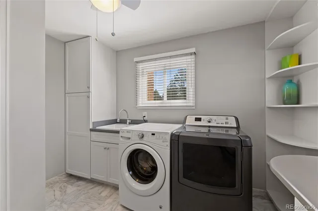 a view of a hallway with wooden floor and stairs