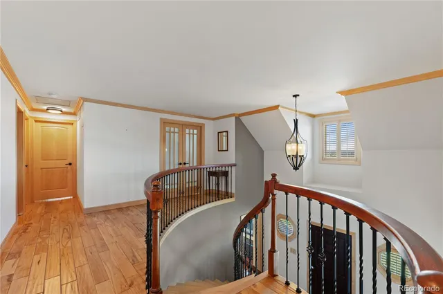 a view of hallway with wooden floor