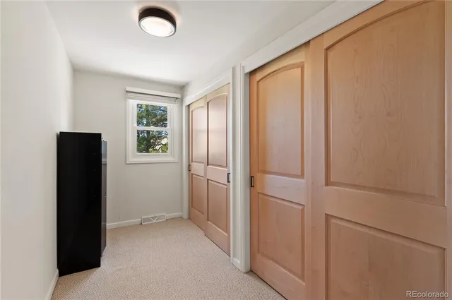a view of an empty room with a fireplace