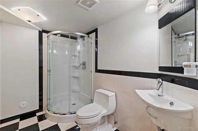 a livingroom with furniture and staircase