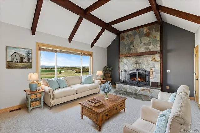 a kitchen with a table chairs refrigerator and cabinets