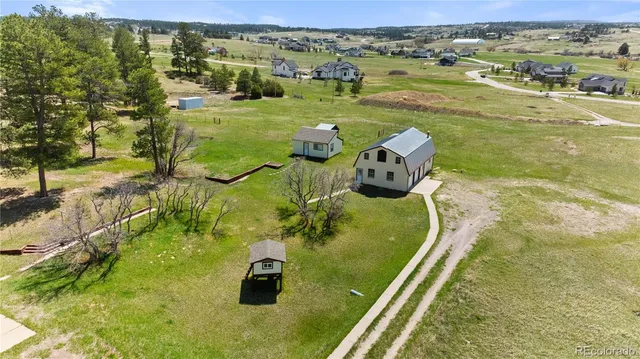 a wooden bench sitting in front of a building