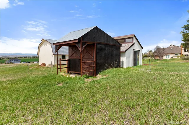 a view of a field with a big yard