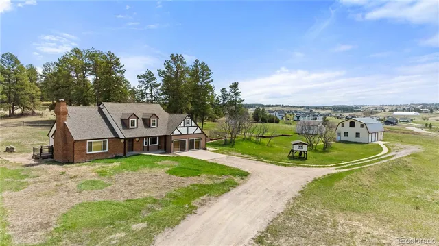 a garden with a bench and some trees