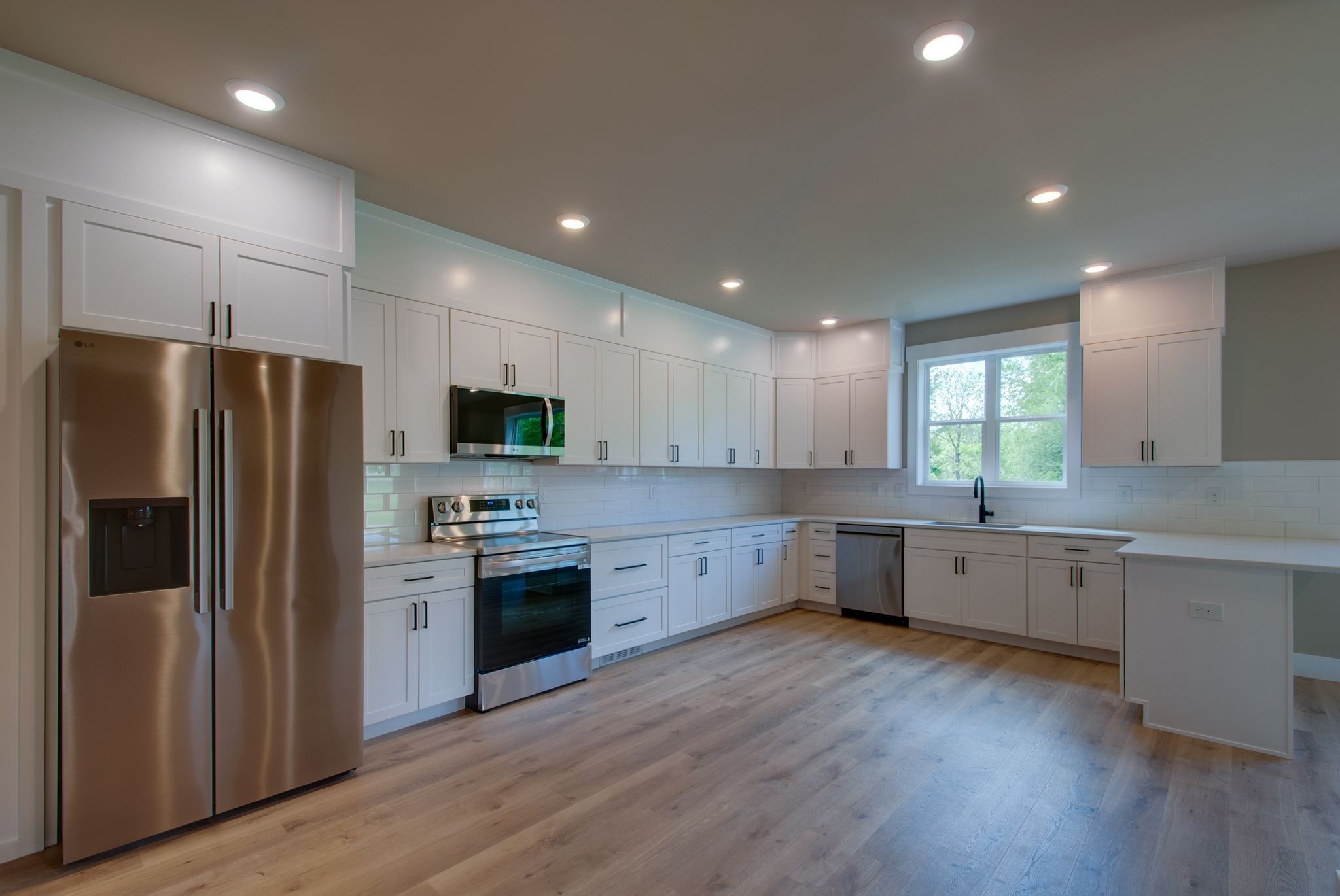 1151 Canaan Road Columbia, TN 38401 - Photo 13 of 40 a kitchen with a refrigerator sink and cabinets