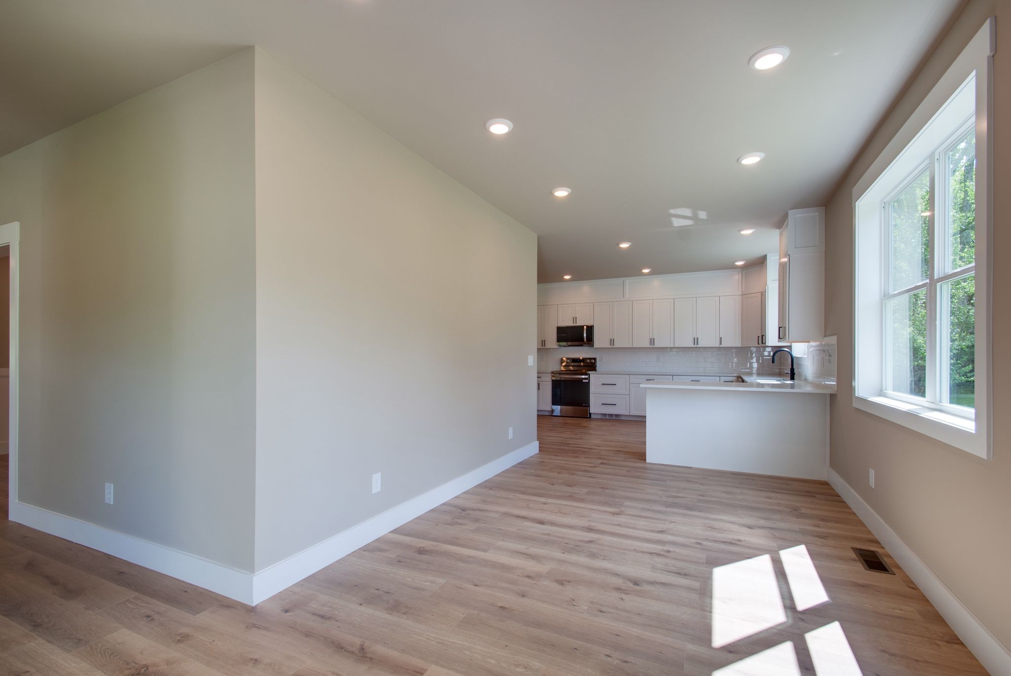 1151 Canaan Road Columbia, TN 38401 - Photo 20 of 40 a view of kitchen with kitchen island wooden floor center island and stainless steel appliances