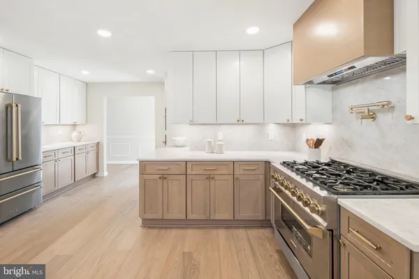 a living room with kitchen island furniture and a potted plant
