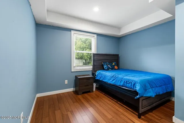 a view of a big yard with a house in the background